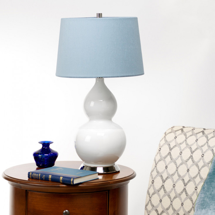 Lampada da tavolo moderna in ceramica e base in acciaio con paralume in tessuto