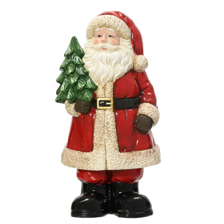 Decorazione natalizia babbo natale con albero in mano