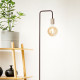Piantana di design in metallo con portalampada in finitura ottone invecchiato