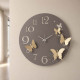 Orologio da parete in metallo con farfalle decorative dal design moderno