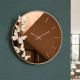 Orologio da parete in metallo con quadrante in vetro dal design moderno