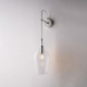 Lampada da parete con singolo diffusore in vetro dal design moderno ed elegante