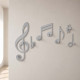 Appendiabiti per ingressi in legno con note musicale intagliate a laser