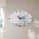 Orologio da parete ovale in cartapietra con lavorazione artistica