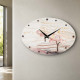 Orologio da parete ovale in cartapietra con lavorazione artistica