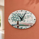 Orologio da parete ovale moderno con bassorilievo con retro in legno massello