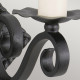 Lampada da parete in ferro battuto dalle linee rustiche senza paralume