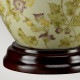 Lampada da tavolo in ceramica con paralume in tessuto dal design orientale