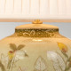 Lampada da tavolo in ceramica e paralume in tessuto dal design orientale