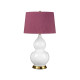 Lampada da tavolo moderna in ceramica e base in ottone con paralume in tessuto