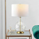 Lampada da tavolo moderna in vetro con base in acciaio e paralume in tessuto