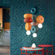 Lampada a sospensione in ceramica con diffusore in vetro dal design moderno