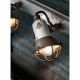 Lampada da parete dal design industrial con 3 diffusori a griglia in ceramica
