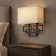 Lampada da parete in acciaio con paralume in tessuto dal design moderno