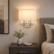 Lampada da parete in acciaio con paralume in tessuto dal design moderno