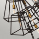 Lampadario a grappolo moderno in acciaio a 7 luci e diffusori geometrici