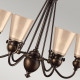 Lampadario con struttura rustica in acciaio e 6 diffusori in vetro ambrato