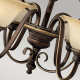 Lampadario in acciaio con 9 diffusori in vetro dal design classico