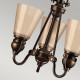 Lampadario rustico con struttura in acciaio e 3 diffusori in vetro ambrato