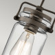 Lampada a sospensione in acciaio con un diffusore in vetro dal design industrial