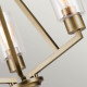 Lampadario in acciaio con triplo diffusore in vetro dal design minimal