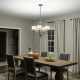 Lampadario rustico in acciaio con diffusori in vetro opalino e maglia di lino