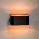 Lampada da parete con struttura ovale in alluminio dalle linee moderne
