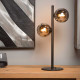 Lampada da tavolo con struttura e base in acciaio 2 diffusori a boccia di vetro