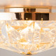 Lampada da soffitto piccola con struttura dorata e diffusori in vetro