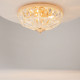 Lampada da soffitto piccola con struttura dorata e diffusori in vetro