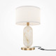 Lampada da tavolo in metallo e pietra dal design moderno e paralume in tessuto