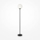 Lampada da terra con struttura in metallo e diffusore in vetro a boccia
