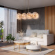 Lampadario moderno con struttura dorata e diffusori in vetro