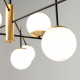 Lampadario moderno per soggiorno con paralumi a bocce di vetro