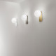 Applique da parete a led con struttura in metallo e diffusore a boccia di vetro