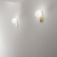 Applique da parete a led con struttura in metallo e diffusore a boccia di vetro