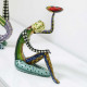 Scultura da tavolo in marmorino dal design eclettico con acrobata seduto